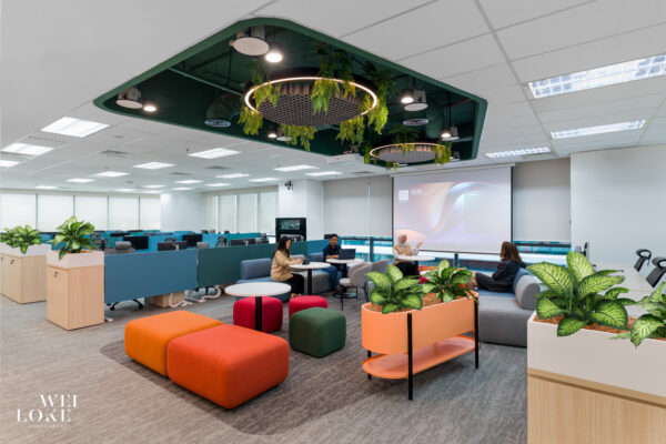 Open waiting area with vibrant furniture and soft textures in Blackmores Malaysia office.