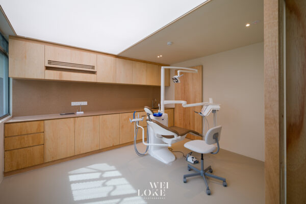 Premium healthcare photography of Tria Dental treatment room with modern clinical layout.